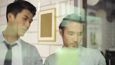 Two corporate people discussing business in office