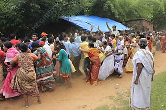 Everyone in the crowd is eager to touch the rope of the rate to get blessing of god.