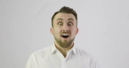4K Close up. Very emotional surprised man looking to the camera.