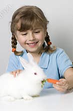 Cute girl and baby rabbit