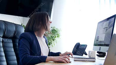 Dancing businesswoman in office