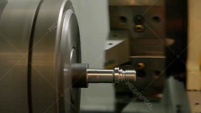 Action of turning lathe.