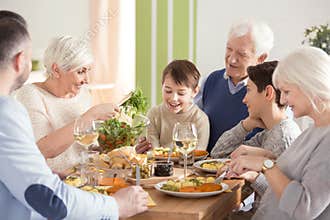 Happy big family eating dinner
