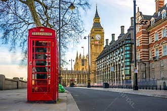 The iconic British old red telephone box with Big Ben, London