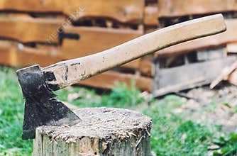 Axe in a log