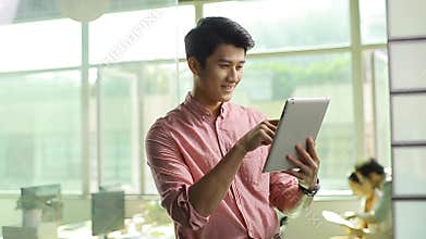 Asian business person using tablet