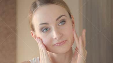 Closeup portrait of beautiful woman touching face skincare concept