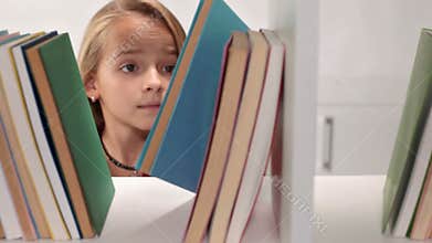 Little girl browsing books