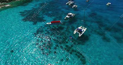 Racha Island Beach. Thailand, Phuket. Yachts , Catamarans and Boats sailing in crrystal clear blue water of ocean