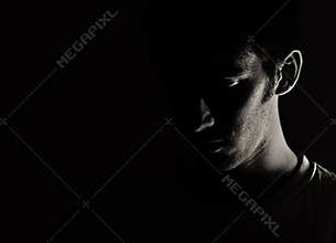 Man's Face in Shadow