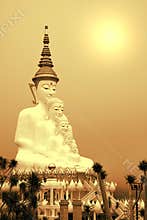 Big five white Buddha statue with the sun light in sepia tone