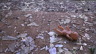 The doll falls to the floor