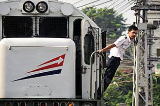 Train company personnel guides the switching process.