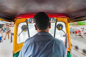 Tuc Tuc rickshaw taxi driver in New Delhi