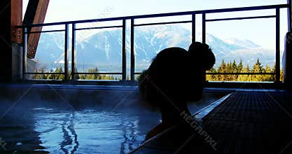 Couple relaxing in swimming pool