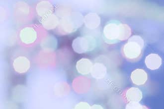Purple colored Christmas bokeh light abstract holiday background.