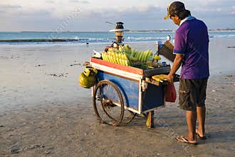 Man grilling corn at beach in Bali