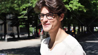 Handsome man making a shushing gesture