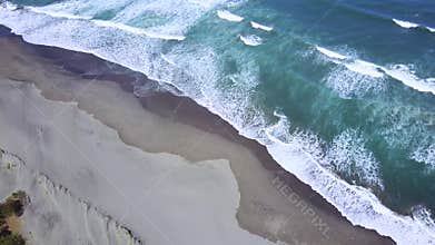 Aerial scenery of beach with frothy wave
