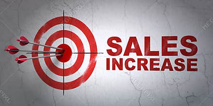 Advertising concept: target and Sales Increase on wall background