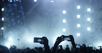 People with Mobile Phones on a Concert