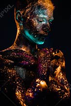 Portrait of a man painted in fluorescent UV colors.
