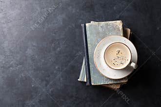 Coffee cup over books