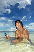 Salesman with cellphone in water