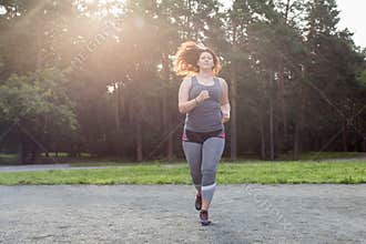 Overweight woman running. Weight loss concept.