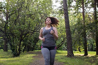 Overweight woman running. Weight loss concept.