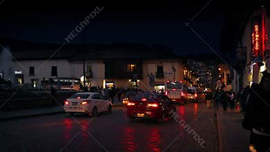 Town Square At Night With People And Cars