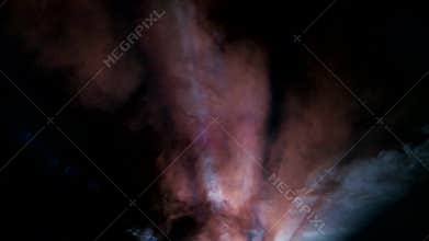 Flashes of rays from projector on black background of cinema