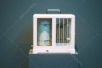 Seismological device for measuring earthquakes. Seismograph records an earthquake on the sheet of measuring paper