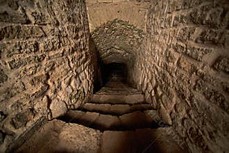 Stepped descent into the dungeon of medieval castle