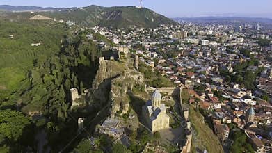 AERIAL. The cityscape of Tbilisi the Narikala fortress. GEORGIA