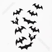 Halloween holiday concept. Handmade black bats on white background. Flat lay, top view.
