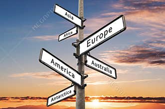 Continents on road direction signpost, with sunset sky background