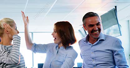 Team of business executives celebrating their success