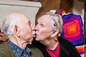 Elderly Couple Kissing