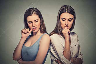 Two angry girls going through a conflict