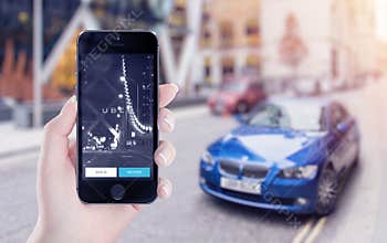 Uber application startup on Apple iPhone display in female hand