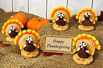 Turkey shaped cookies with Happy Thanksgiving card on burlap