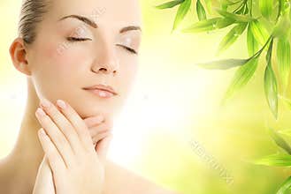 Woman applying organic cosmetics to her skin