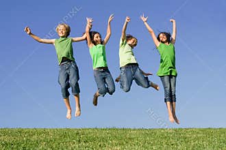 Group of kids jumping at summer camp