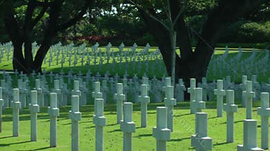 Manila, American Cemetery, rows of white crosses, wide shot still in Manila, Philippines