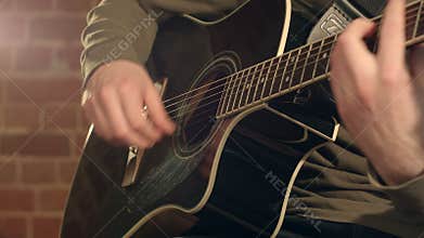 Guitar in male hands