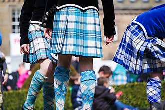 Traditional scottish Highland dancing in kilts