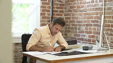 Time Lapse Sequence Of Businessman Working At Desk In Office