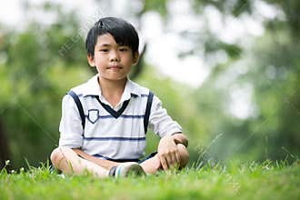 Portrait of a little asian boy in the park