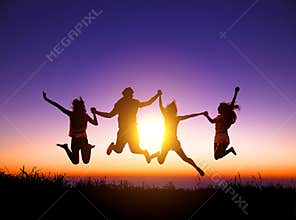happy young people jumping on the mountain